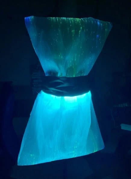 The wearable prototype in a blue lighting state.